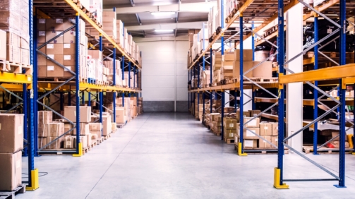 Shelves full of boxes in a warehouse.