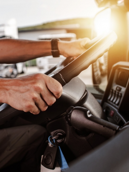 CDL Commercial Driver Inside of His Truck. Transportation Industry Theme.
