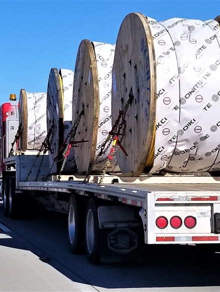 transportation-and-logistics-a-flat-bed-trailer-t20_nRPxy4